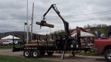 Using a log loader to handle Christmas trees 